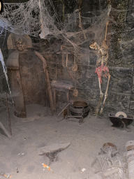 Skeleton and spider webs at the queue of the Pirates of the Caribbean attraction at Adventureland at Disneyland Park, by night