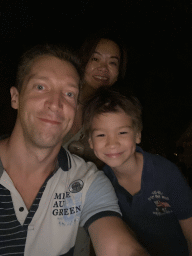 Tim, Miaomiao and Max right after visiting the Big Thunder Mountain attraction at Frontierland at Disneyland Park, by night