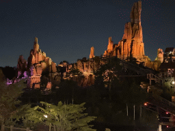 The Big Thunder Mountain attraction at Frontierland at Disneyland Park, viewed from the staircase to the Phantom Manor attraction, by night