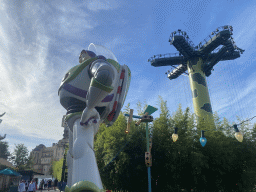 Statue of Buzz Lightyear in front of the Toy Soldiers Parachute Drop attraction at the Toy Story Playland at Walt Disney Studios Park