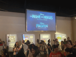 TV screen with information on the Frozen - A Musical Invitation show and posters at the lobby of the Animation Celebration building at the Toon Studio at Walt Disney Studios Park