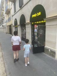 Miaomiao and Max in front of the Pho 14 restaurant at the Rue d`Ariane street at Chessy