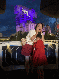 Miaomiao and Max in front of the Twilight Zone Tower of Terror attraction at the Production Courtyard at Walt Disney Studios Park, by night