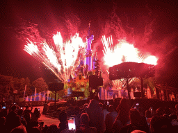 Front of Sleeping Beauty`s Castle at Fantasyland at Disneyland Park, with illuminations, fireworks and fountains during the Disney Illuminations show, viewed from Central Plaza, by night