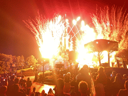 Front of Sleeping Beauty`s Castle at Fantasyland at Disneyland Park, with illuminations and fireworks during the Disney Illuminations show, viewed from Central Plaza, by night