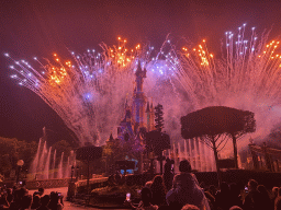 Front of Sleeping Beauty`s Castle at Fantasyland at Disneyland Park, with illuminations, fireworks and fountains during the Disney Illuminations show, viewed from Central Plaza, by night