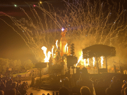 Front of Sleeping Beauty`s Castle at Fantasyland at Disneyland Park, with illuminations, fireworks and fire during the Disney Illuminations show, viewed from Central Plaza, by night