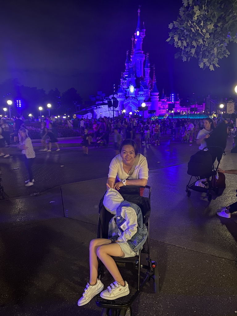 Miaomiao and Max at Central Plaza in front of Sleeping Beauty`s Castle at Fantasyland at Disneyland Park, right after Disney Illuminations show, by night