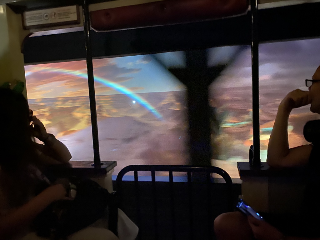 Image of a lanscape with a rainbow at Frontierland at Disneyland Park, viewed from the train at the Disneyland Railroad attraction