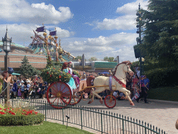 Belle at a horse and carriage at the World Princess Week Parade at Central Plaza at Disneyland Park