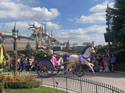 Sleeping Beauty at a horse and carriage at the World Princess Week Parade at Central Plaza at Disneyland Park