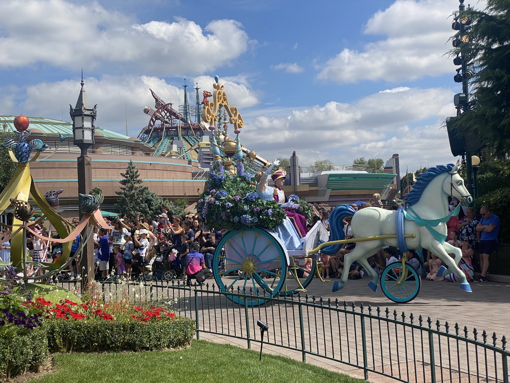 Cinderella at a horse and carriage at the World Princess Week Parade at Central Plaza at Disneyland Park