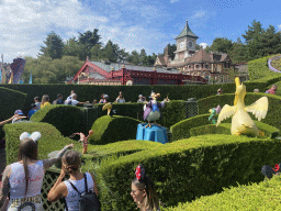 Statues at the Alice`s Curious Labyrinth attraction at Fantasyland and the front of the Meet Mickey Mouse attraction at Disneyland Park