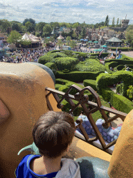 Max at the Queen of Hearts` Castle at the Alice`s Curious Labyrinth attraction at Fantasyland at Disneyland Park, with a view on the surroundings