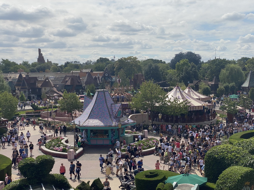 The La Petite Maison des Jouets store and the Dumbo the Flying Elephant attraction at Fantasyland at Disneyland Park, viewed from the Queen of Hearts` Castle at the Alice`s Curious Labyrinth attraction