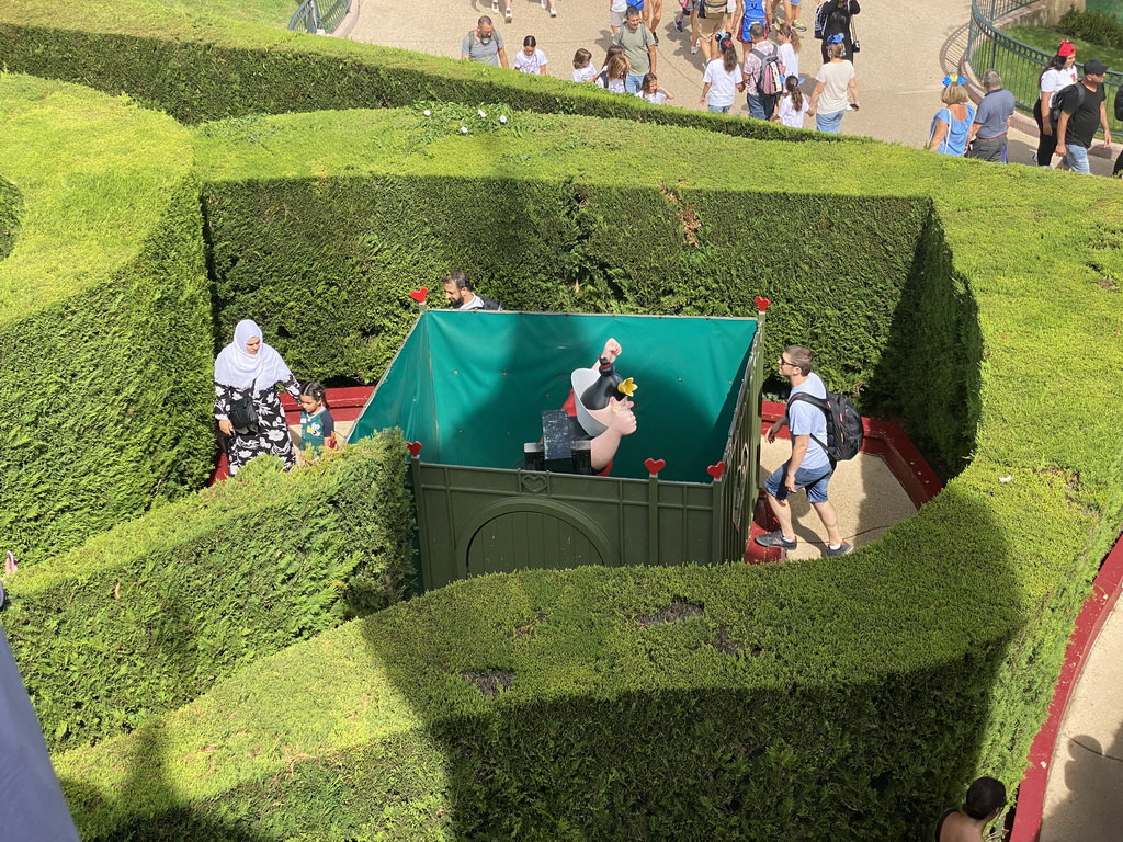 Statue of the Queen of Hearts at the Alice`s Curious Labyrinth attraction at Fantasyland at Disneyland Park, viewed from the Queen of Hearts` Castle