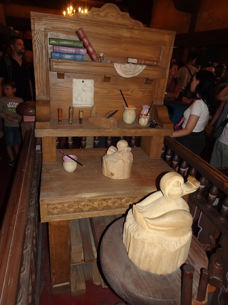 Books, brushes and sculptures at the queue of the Les Voyages de Pinocchio attraction at Fantasyland at Disneyland Park