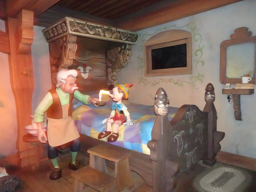 Statues of Pinocchio and Geppetto at the Les Voyages de Pinocchio attraction at Fantasyland at Disneyland Park