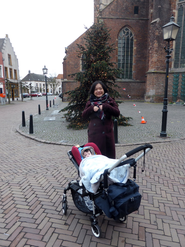 Miaomiao and Max in his buggy front of a christmas tree at the southeast side of the Martinikerk church at the Markt square