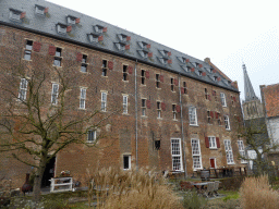 East side of the Arsenaal building at the Kloostersteeg street and the tower of the Martinikerk church