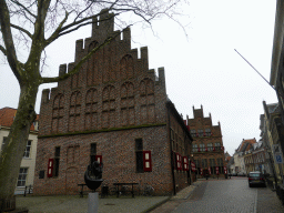 The Roggestraat street with the back side of the City Hall and the front of the Waag building