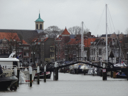Boats and the Langeijzerenbrug bridge over the Nieuwe Haven harbour and the Bonifatiuskerk church, viewed from the Engelenburgerbrug bridge