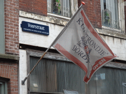Flag and street sign at the Voorstraat street