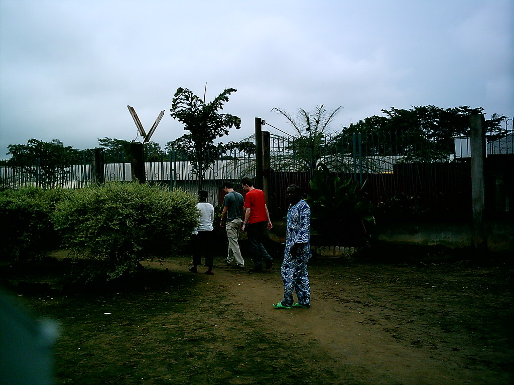 Tim, his friend and the chicken farmer at the chicken farm