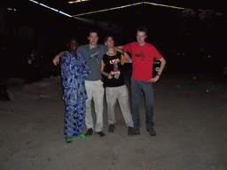 Tim, his friends and the chicken farmer at the chicken farm