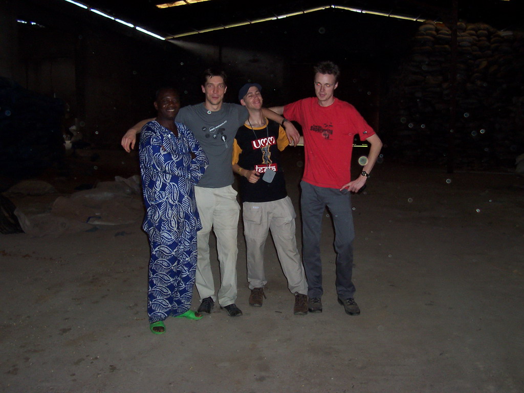 Tim, his friends and the chicken farmer at the chicken farm