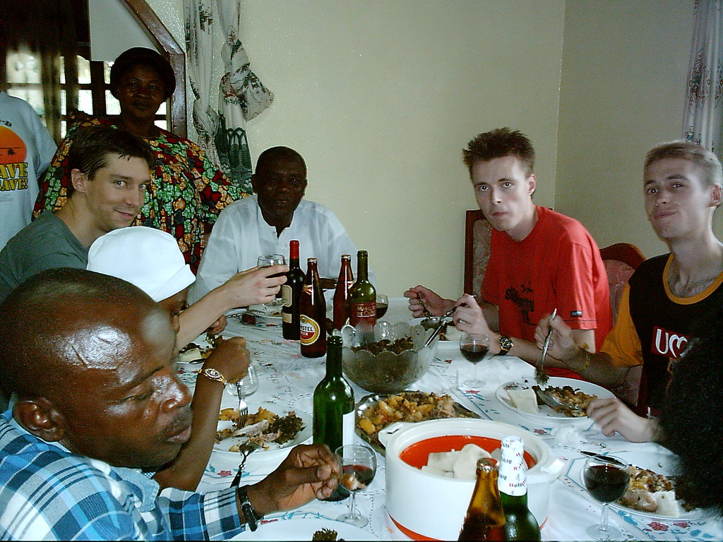 Tim and his friends eating at the chicken farmer`s house