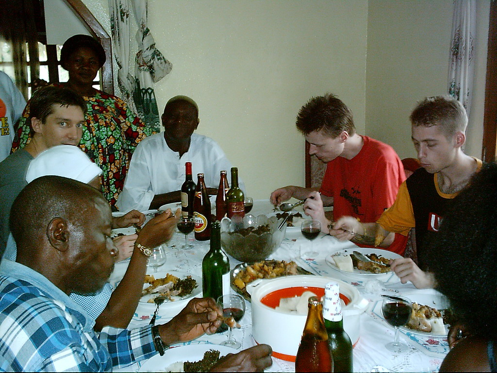 Tim and his friends eating at the chicken farmer`s house