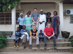 Tim and his friends in front of the chicken farmer`s house