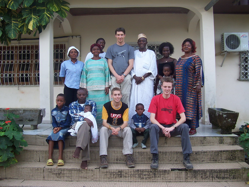 Tim and his friends in front of the chicken farmer`s house