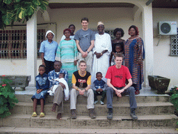 Tim and his friends in front of the chicken farmer`s house