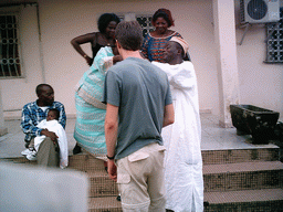 Tim and his friends in front of the chicken farmer`s house