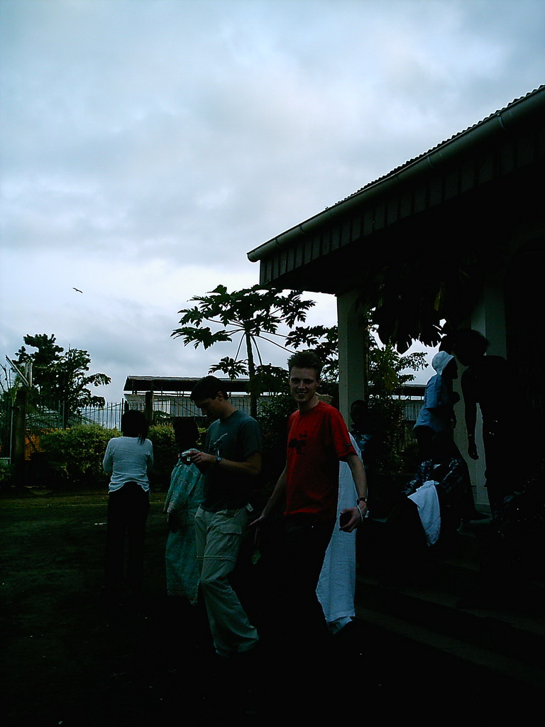 Tim and his friends in front of the chicken farmer`s house