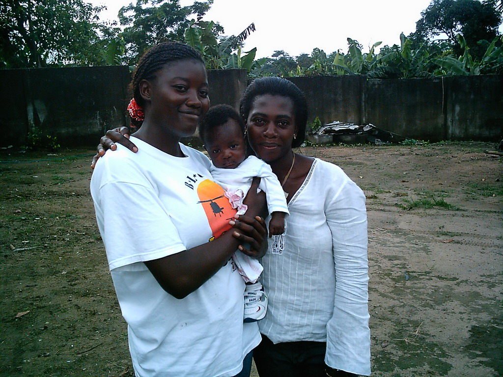 Our friends in front of the chicken farmer`s house