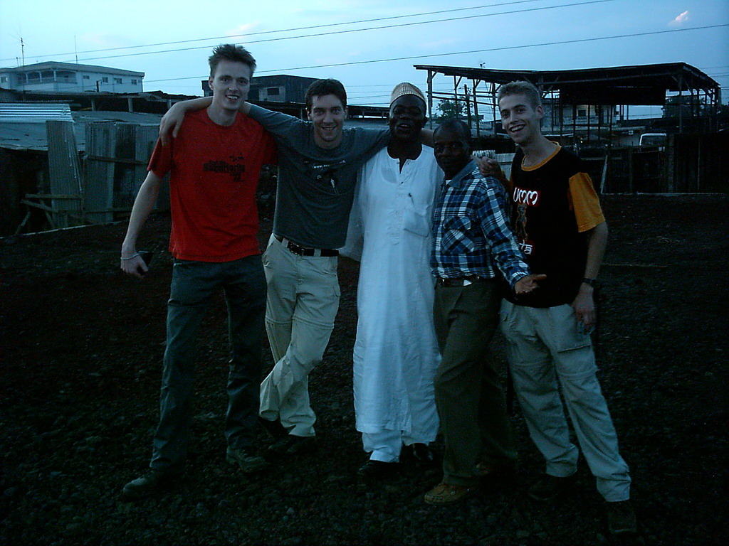 Tim and his friends at a square, at sunset