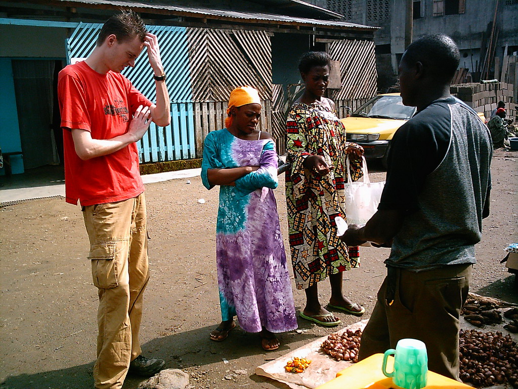 Tim`s friends buying food at the market street near our friend`s house