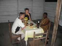 Tim`s friends eating fish in a restaurant along the road from Bamenda