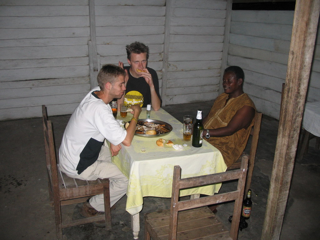 Tim`s friends eating fish in a restaurant along the road from Bamenda