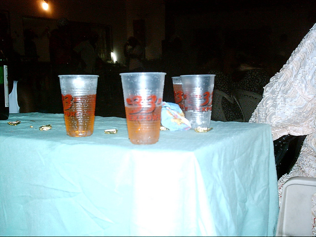 Plastic cups with beer at a party at the Bonabéri port