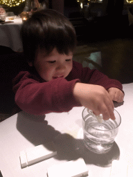 Max playing with tableware at the La Provence restaurant