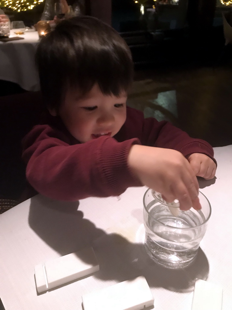 Max playing with tableware at the La Provence restaurant