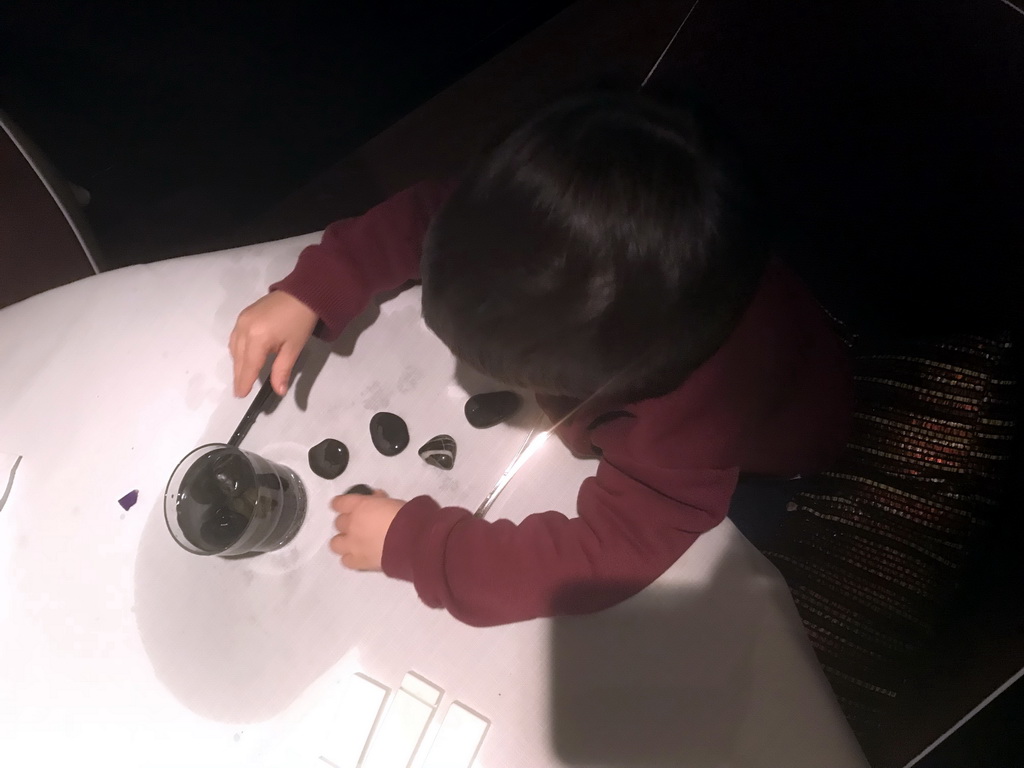 Max playing with stones at the La Provence restaurant