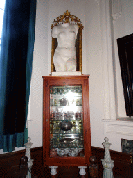 Cabinet and statue above the main staircase of Castle Sterkenburg