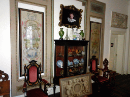 Cabinet and chairs in the area at the upper end of the main staircase of Castle Sterkenburg