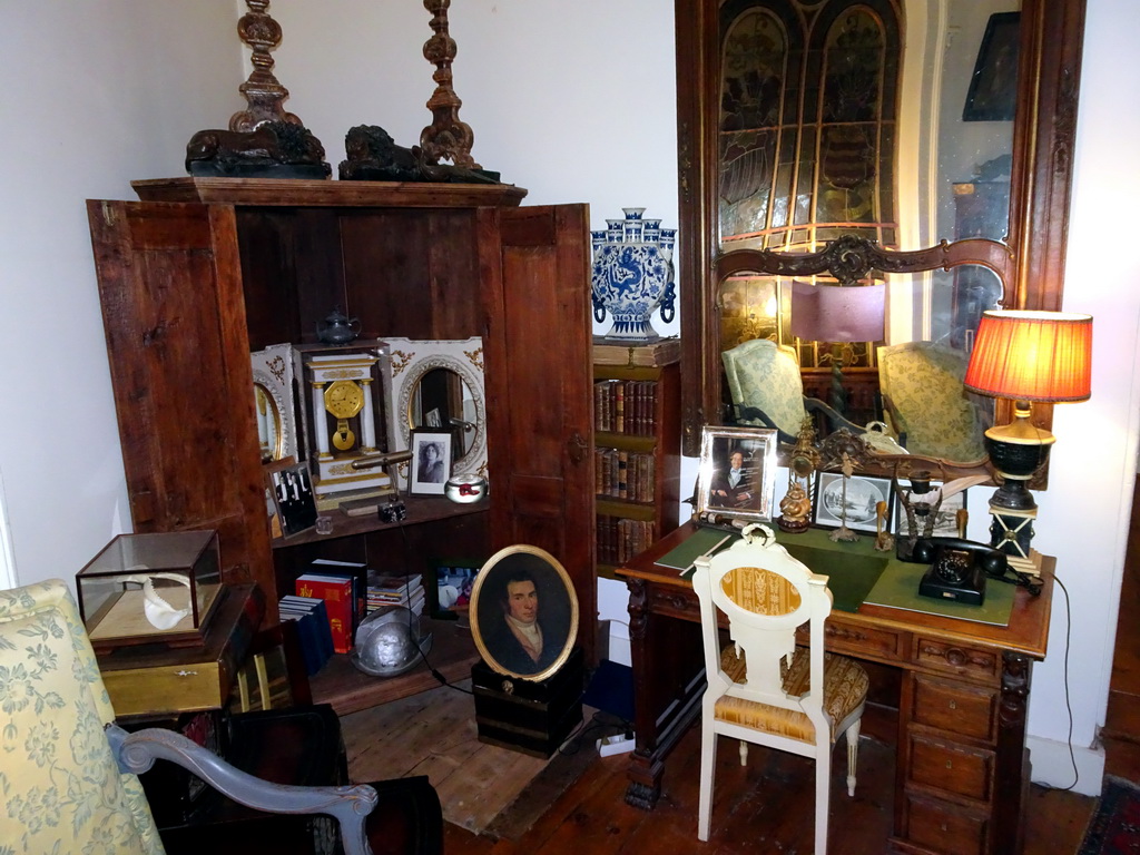 Cabinet and desk in a hallway at the upper floor of Castle Sterkenburg