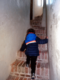 Max climbing the stairs of the Tower of Castle Sterkenburg